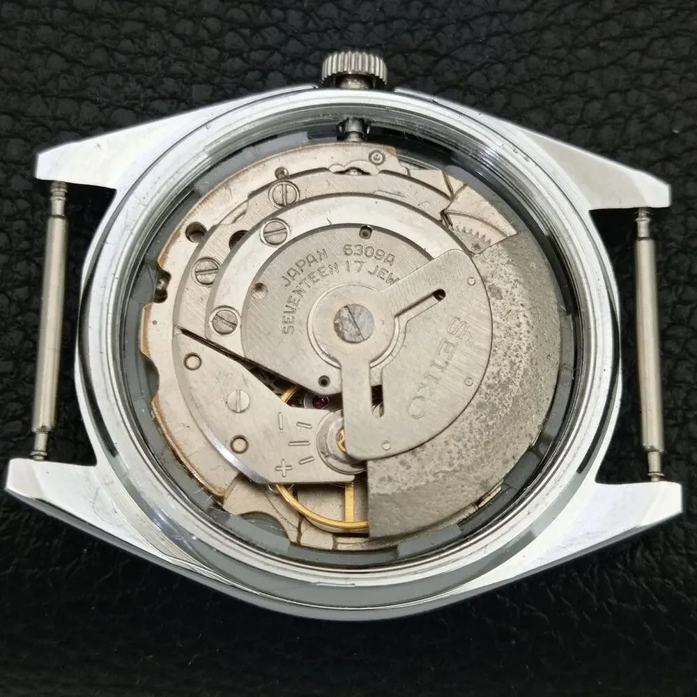 Vintage 1973 Seiko Automatic Mens Silver Watch W/daydate & Arabic accents